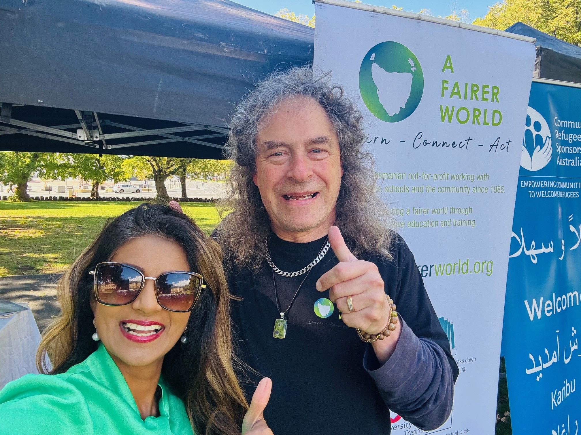 Zelah and David at the International Day of Eliminating Racism and Discrimination event outside at our stall.