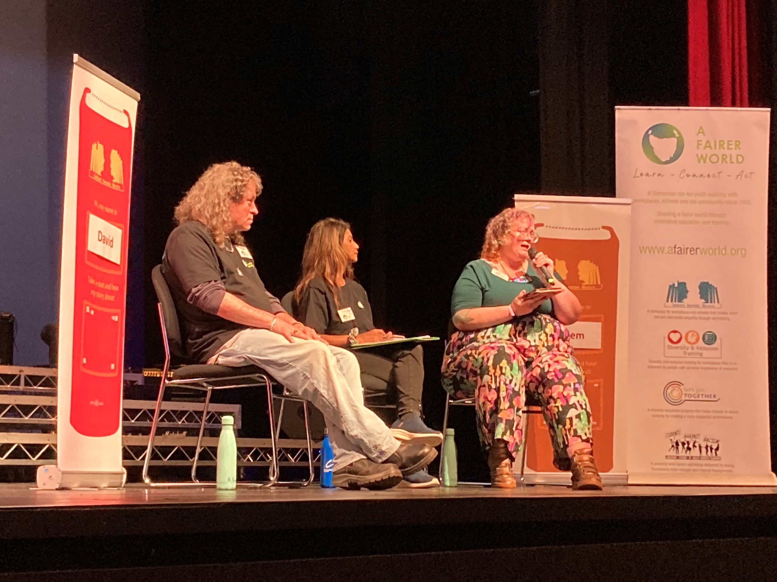A Fairer World on stage at Hobart College presenting a workshop